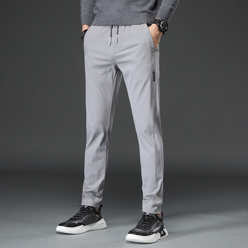 Men's slim fit sports pants with elastic waistband and practical zip pockets Lune London