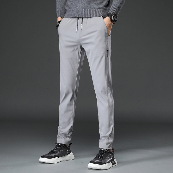 Men's slim fit sports pants with elastic waistband and practical zip pockets Lune London