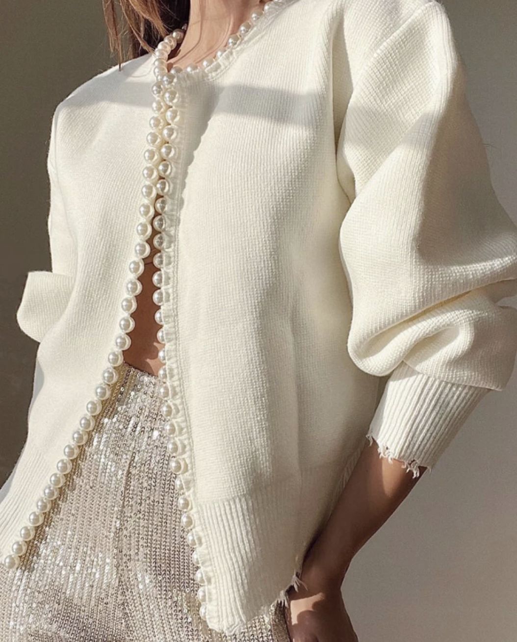 Women's knit jacket with striking bead embellishments and an open design Lune London