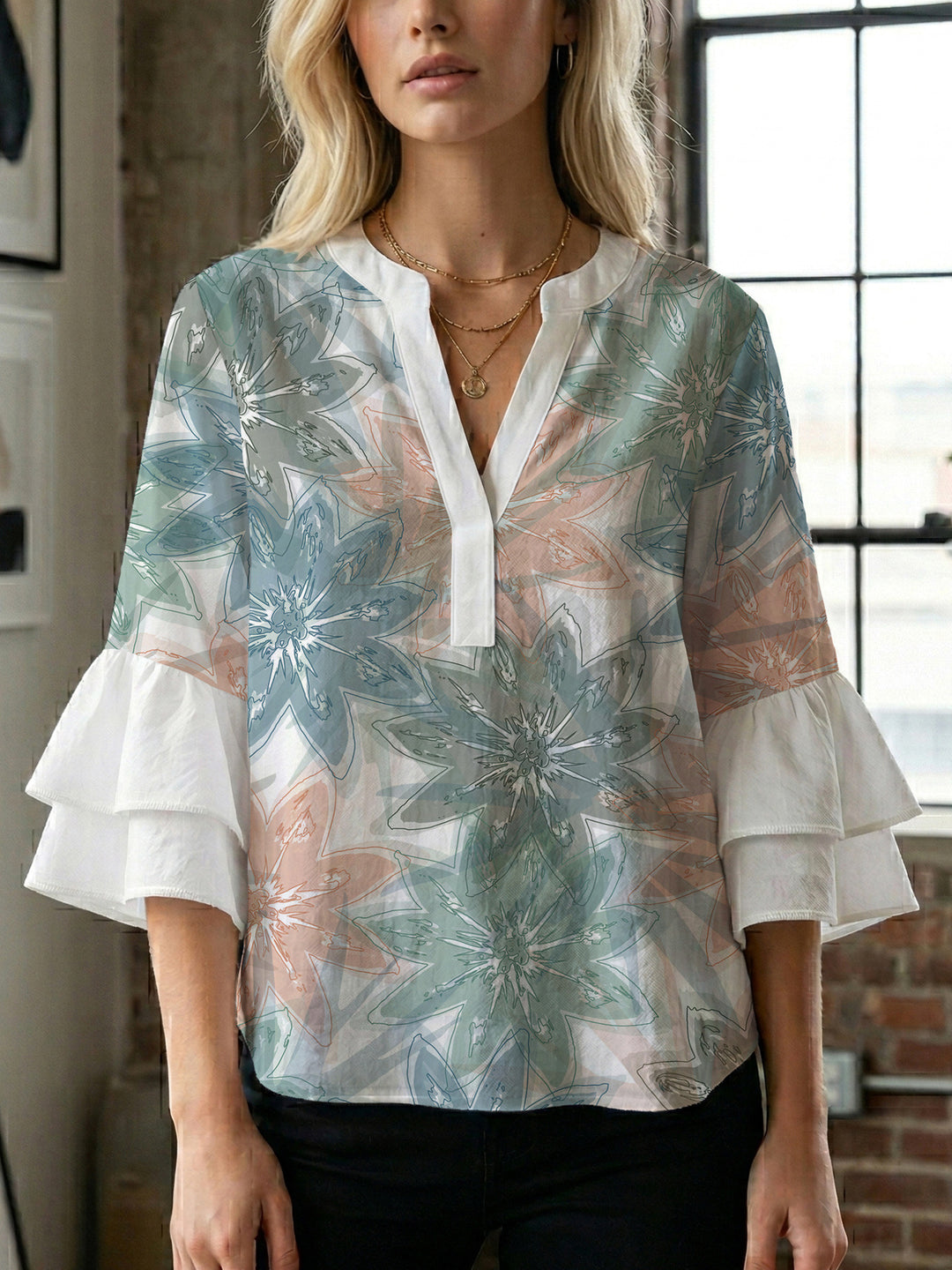 Ladies elegant top with voluminous ruffle hems and floral design Lune London