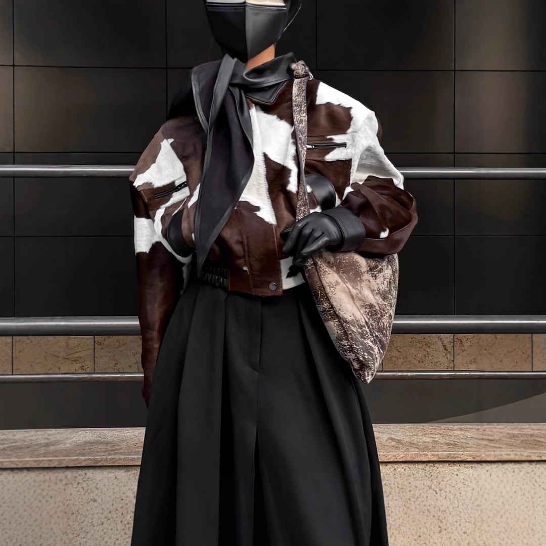 Ladies stylish faux leather jacket with a modern design in chic animal fur