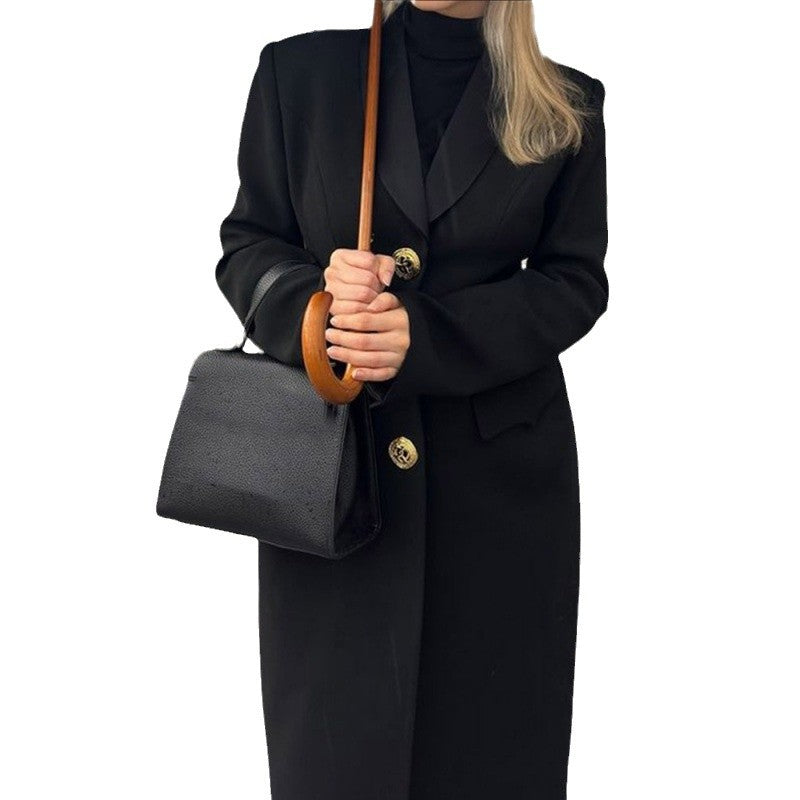 Ladies elegant maxi coat with decorative buttons and practical pockets Lune London
