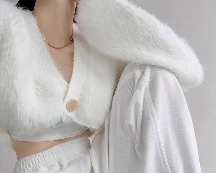 Cropped knitted jacket for women with voluminous sleeves and button detail Lune London