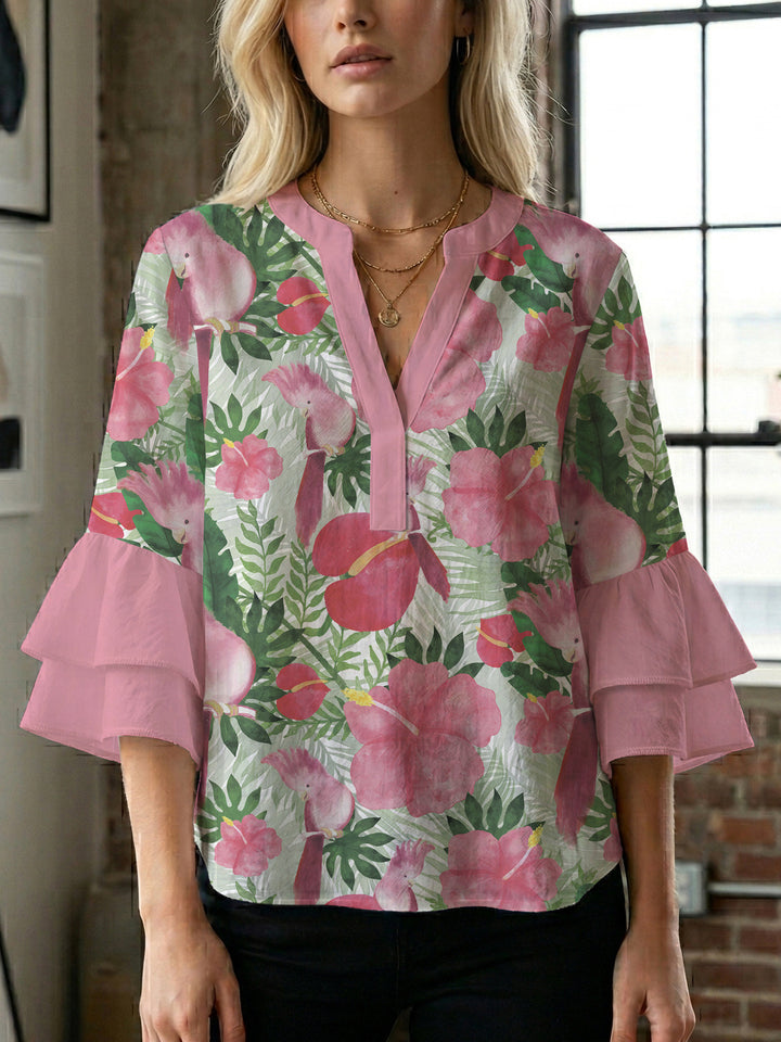 Women’s blouse with voluminous ruffled sleeves and floral pattern Lune London