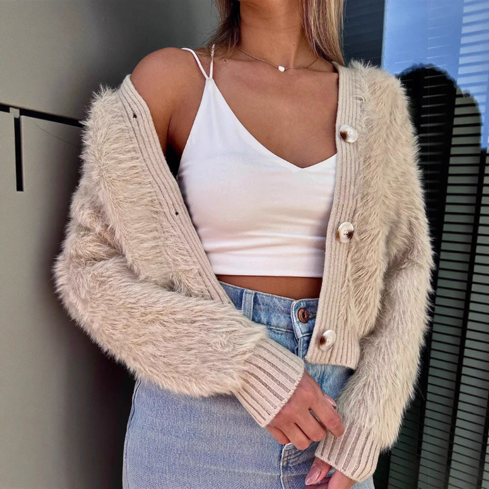 Ladies cozy cardigan with a plush texture and chic button details