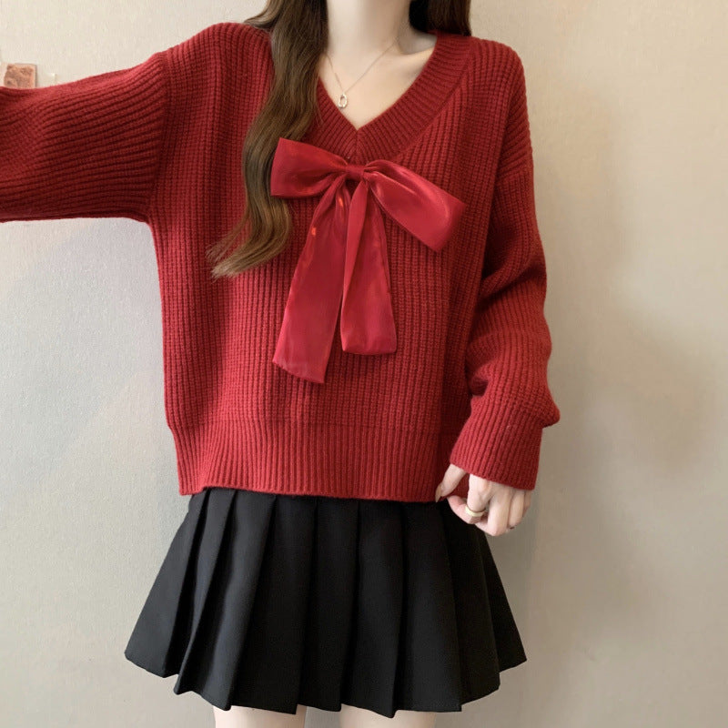 Knitted sweater for women with V-neck and decorative bow accent Lune London