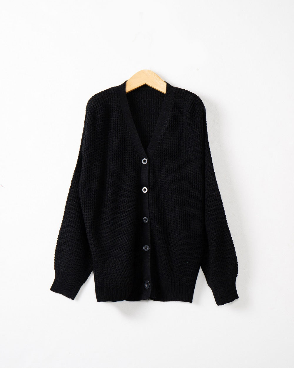 Women's knitted jacket with structured pattern and practical button details Lune London