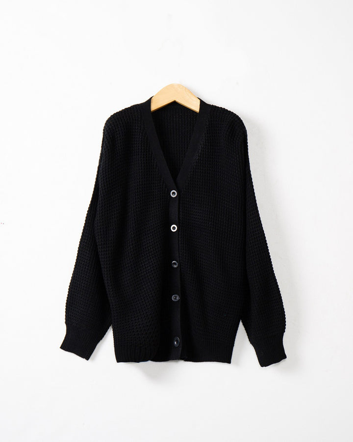 Women's knitted jacket with structured pattern and practical button details Lune London
