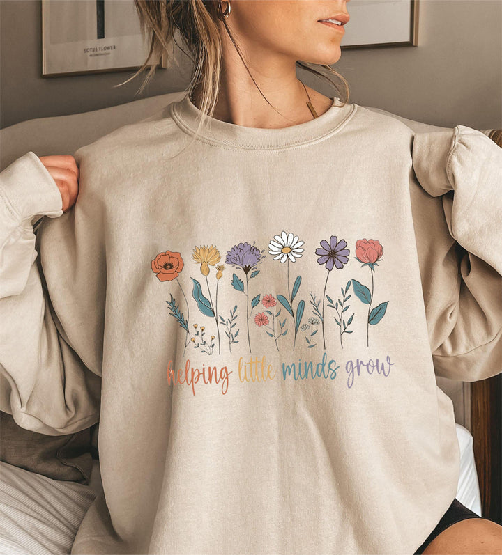 Sweat-shirt femme avec des manches volumineuses et un imprimé floral motivant Chic & Stil
