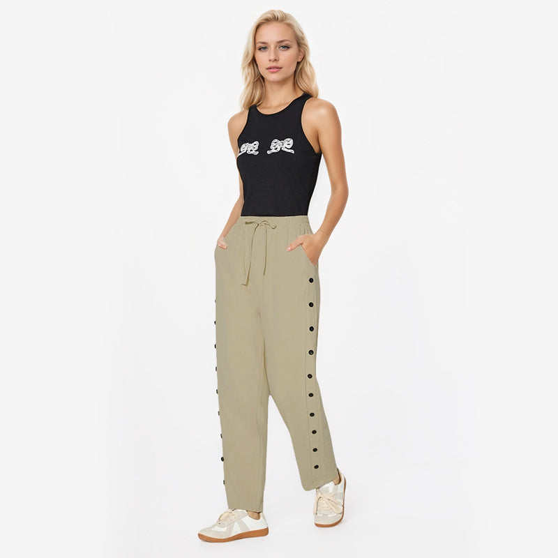 Women's fashionable jogger pants with decorative button details Chic & Stil