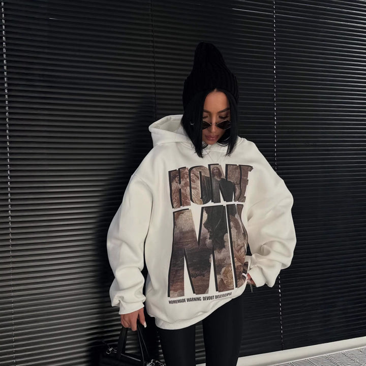 Dames sweat à capuche oversize avec impression graphique accrocheuse Chic & Stil