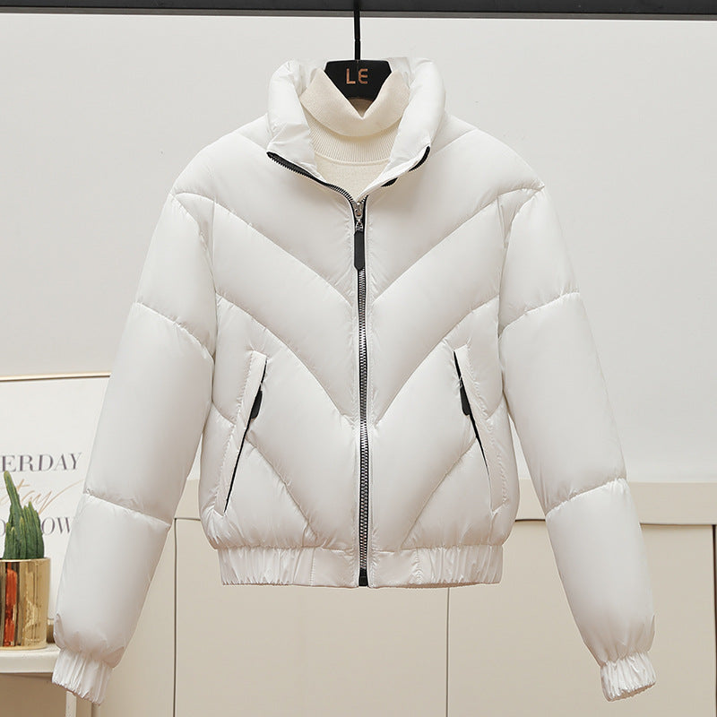 Trendy and comfortable women's puffer jacket with high collar and practical piped pockets Lune London