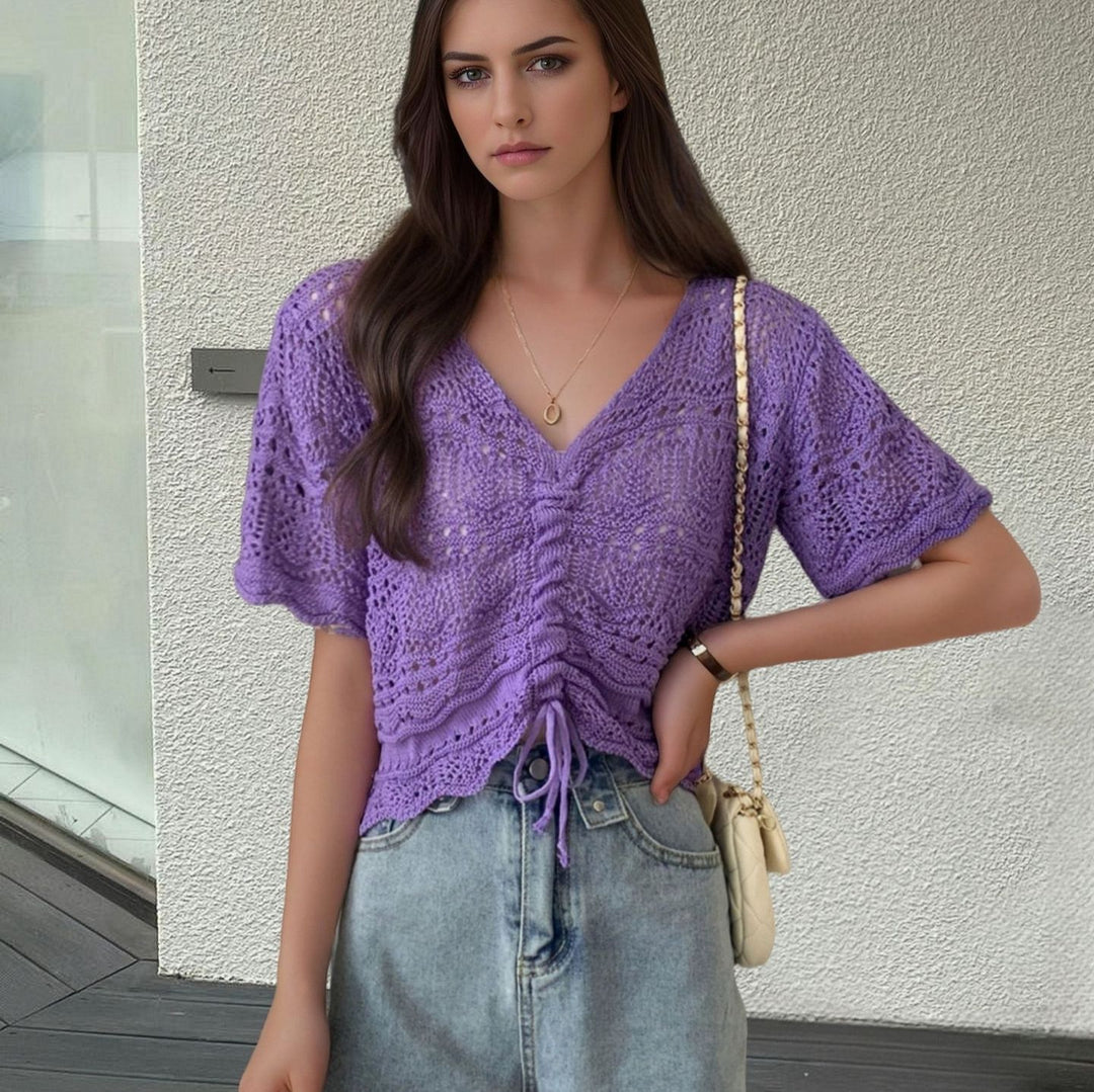 Women's knit top with decorative hole pattern and adjustable hem Lune London