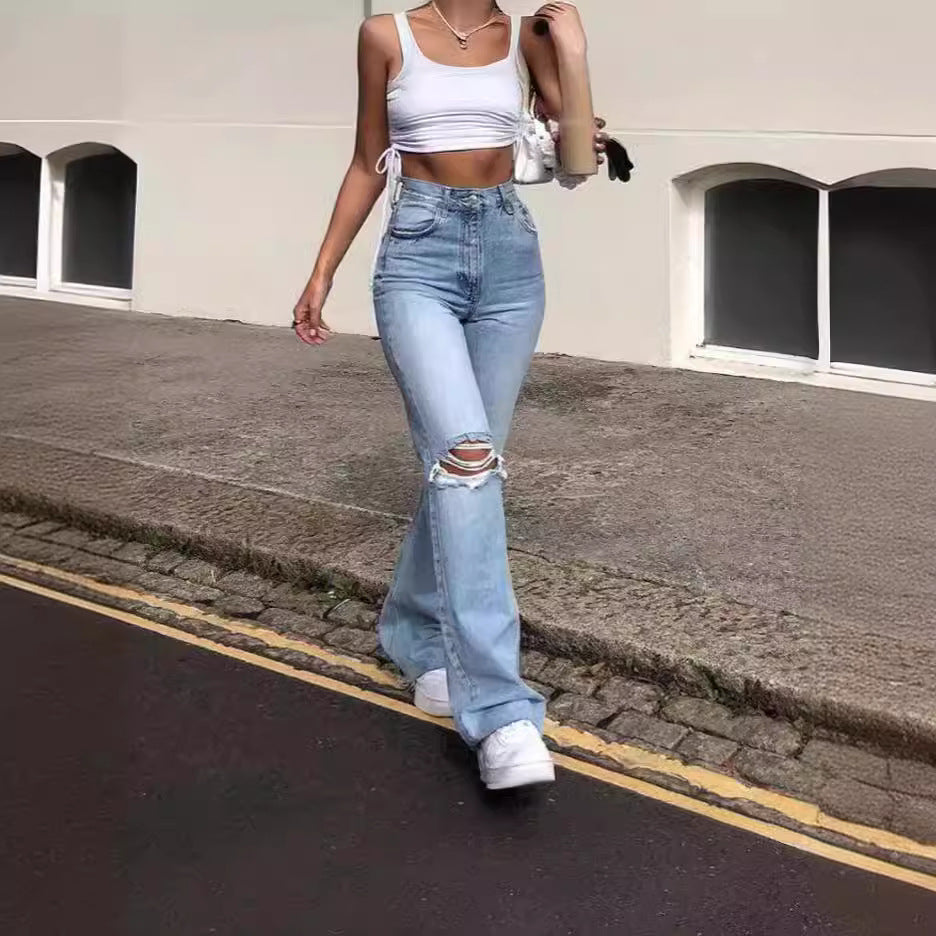 Ladies vintage flared jeans with stylish ripped details and high waistband Lune London