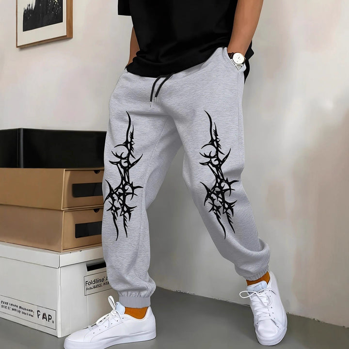 Men's Relaxed Fit Jogging Pants with Eye-Catching Graphic Design Chic & Stil