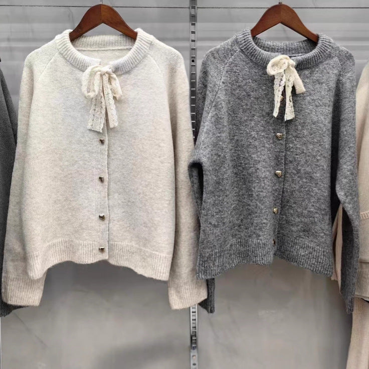 Women's knit jacket with playful lace ribbon and golden heart-shaped buttons Lune London