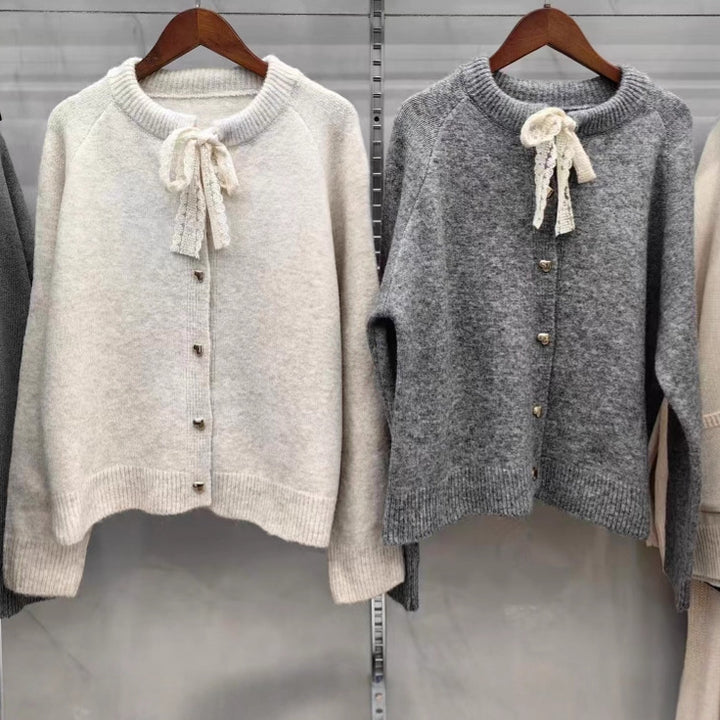 Women's knit jacket with playful lace ribbon and golden heart-shaped buttons Lune London