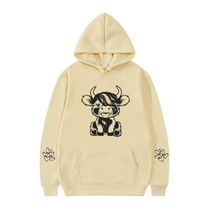 Women's hooded sweatshirt with charming cow motif and practical kangaroo pockets Lune London