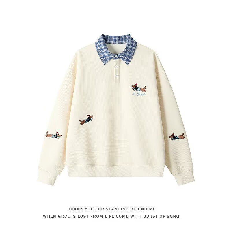 Women's sweater with an elegant checkered pattern and a chic animal print.