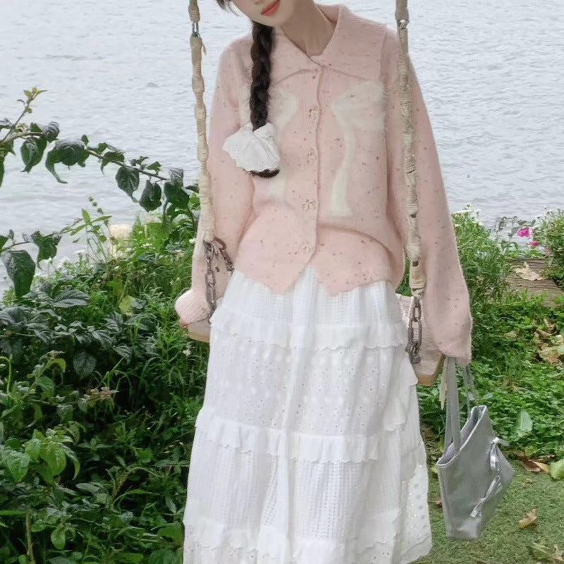 Women’s playful knitted vest with decorative button details and fluffy applications Lune London