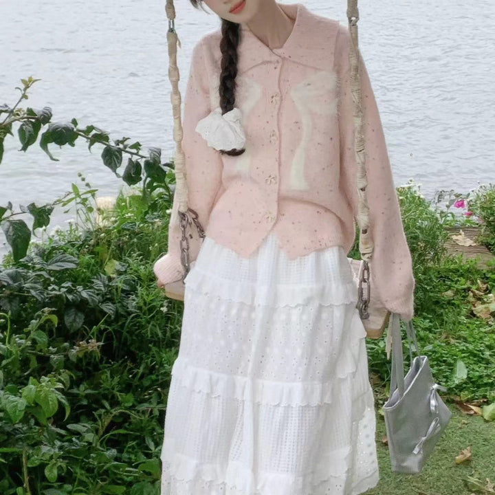 Women’s playful knitted vest with decorative button details and fluffy applications Lune London