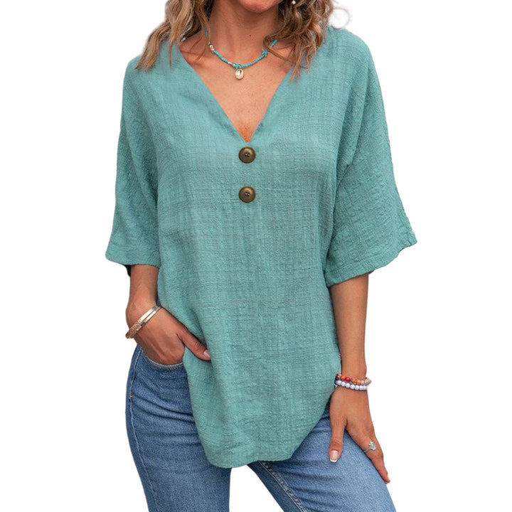 Ladies' V-neck blouse with decorative buttons and chic casual cut