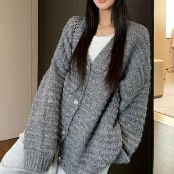 Knitted jacket for women with voluminous sleeves and a unique mesh structure Lune London