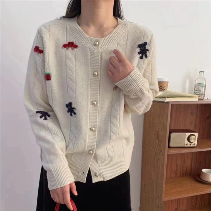 Cardigan en tricot confortable pour femmes avec un design ludique et des boutons pratiques Chic & Stil