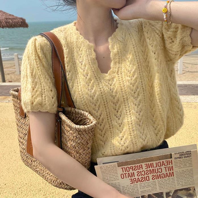 Knitted sweater for women with a feminine openwork pattern Lune London