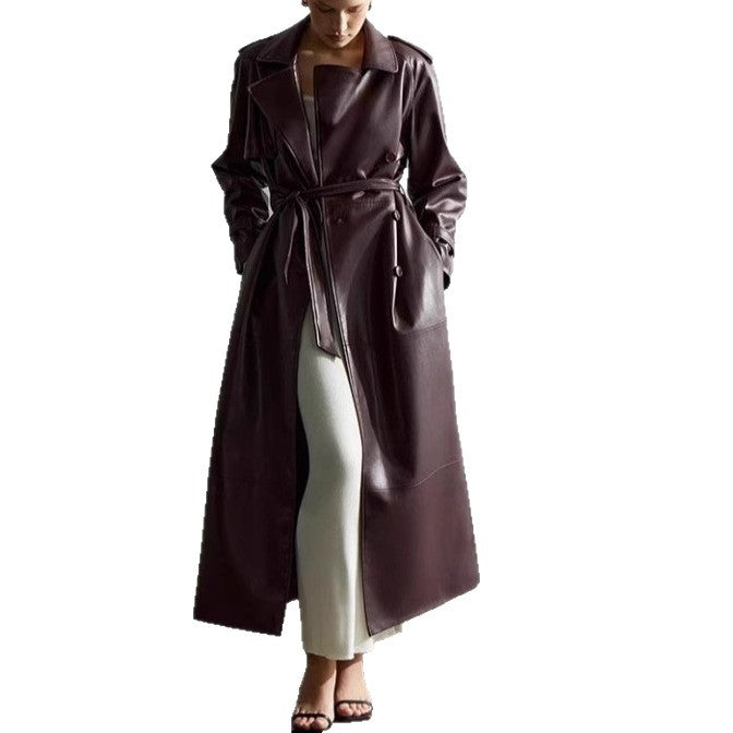 Elegant trench coat in faux leather for women with belt and chic fashion details