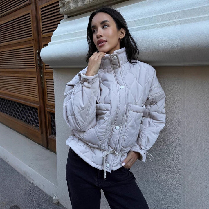 Quilted transitional jacket for women with high collar and drawstring Lune London