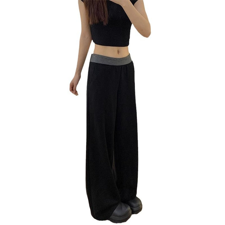 Women's casual fabric trousers with a wide cut and elastic waistband