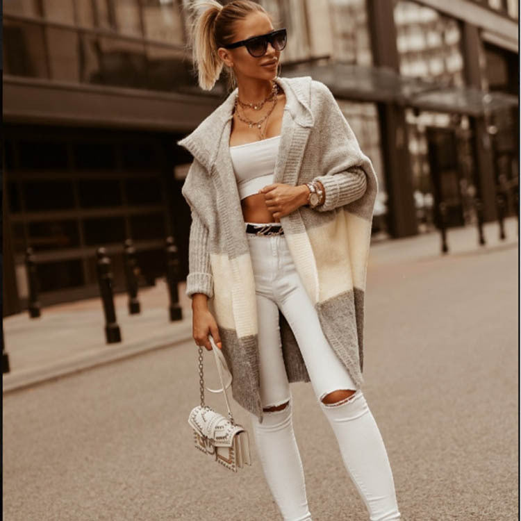 Women knitted poncho with hood and modern color block design Lune London