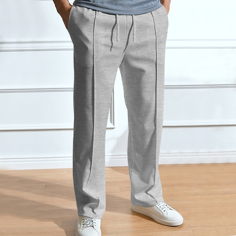 Men's leisure pants with elastic waistband and side snap buttons Lune London