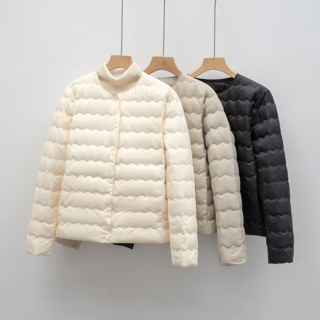 Ladies lightweight quilted jacket with high collar and elastic cuffs Lune London