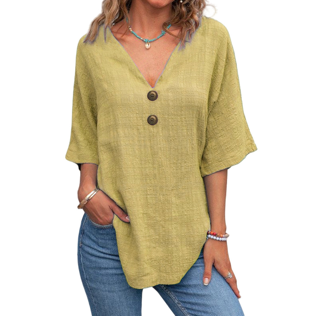 Ladies' V-neck blouse with decorative buttons and chic casual cut