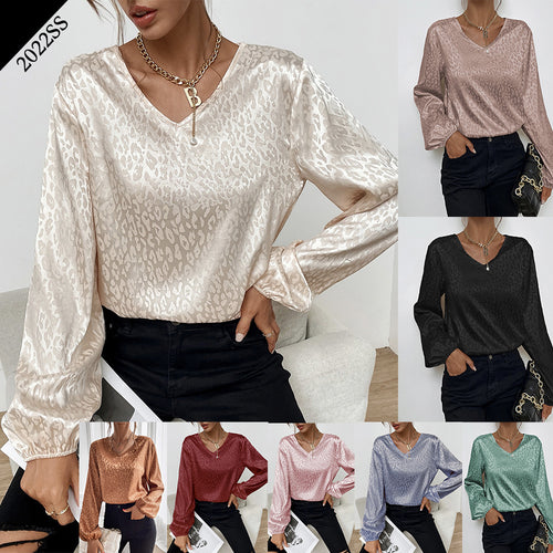 Blouse élégante pour femmes avec col en V et manches volumineuses Chic & Stil
