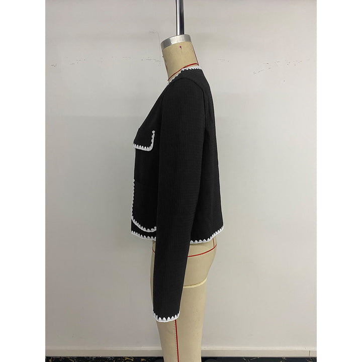 Elegant women's blazer jacket with short sleeves featuring contrasting piping embellishments and Lune London pockets