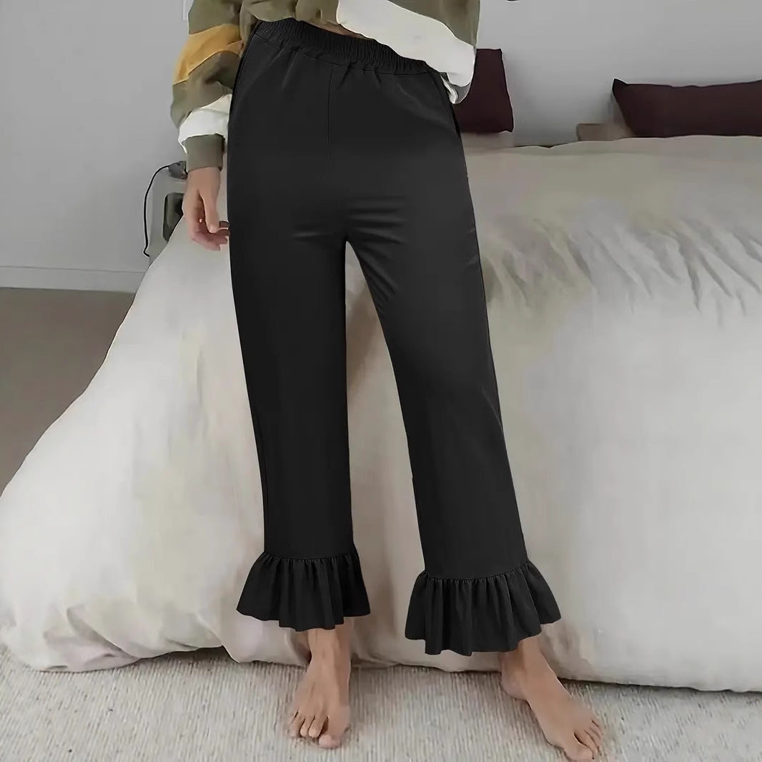 Women's flared pants with playful ruffle details Lune London