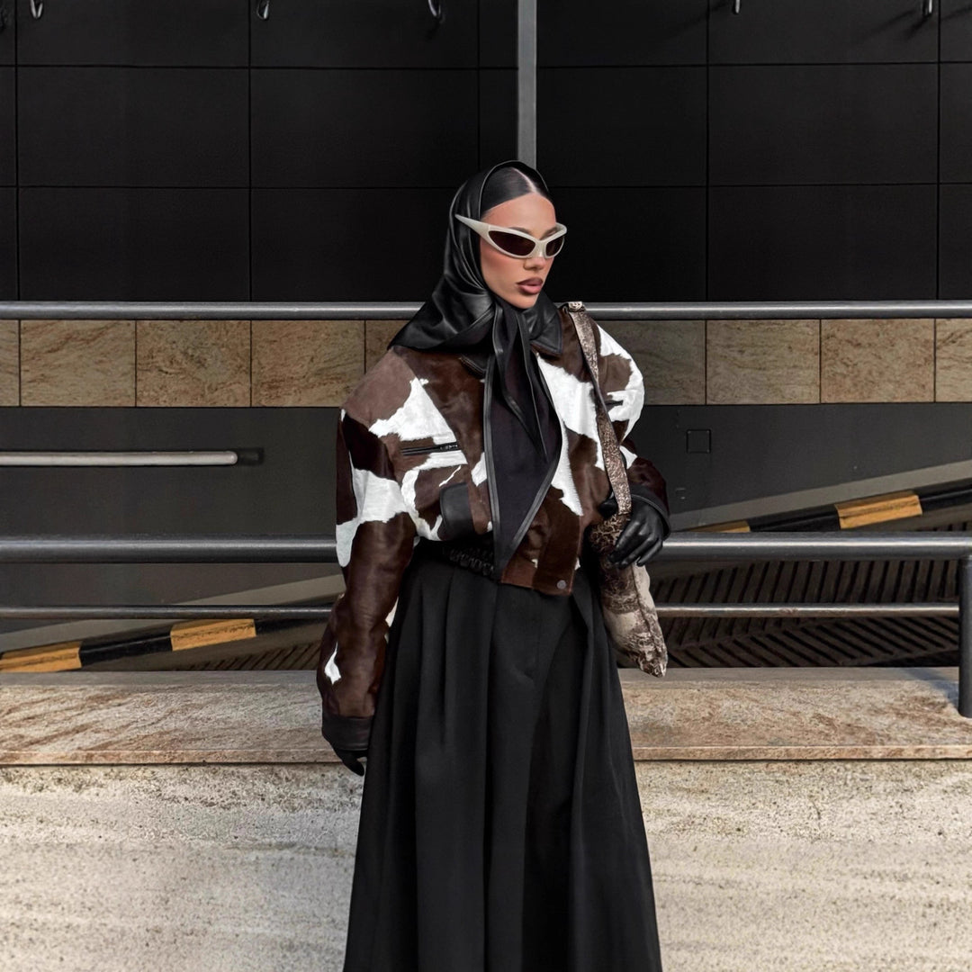 Ladies stylish faux leather jacket with a modern design in chic animal fur