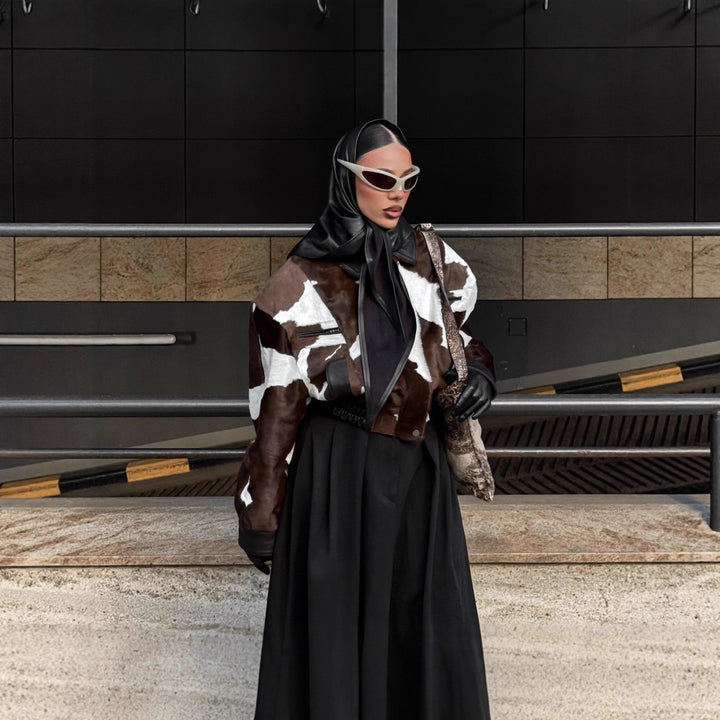 Ladies stylish faux leather jacket with a modern design in chic animal fur