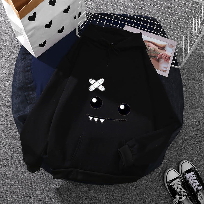 Women's hoodie with playful monster design Chic & Stil