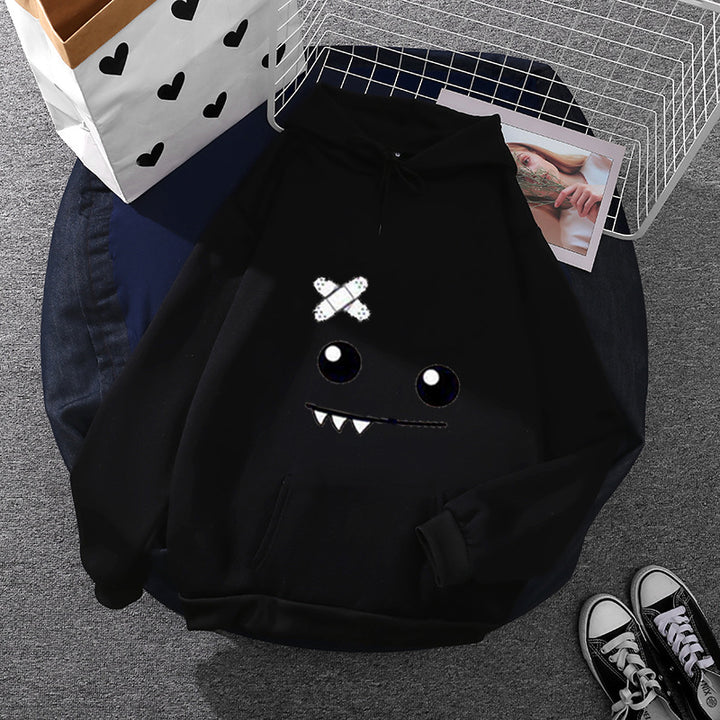 Women's hoodie with playful monster design Chic & Stil