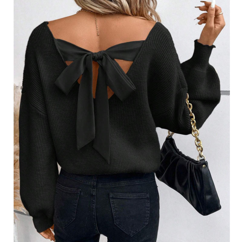 Pull en tricot pour femmes avec un décolleté en V profond et un détail de nœud décoratif Chic & Stil