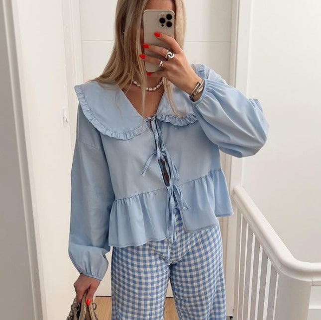 Blouse ludique pour femmes avec ourlet à volants et fermeture par nœud Chic & Stil