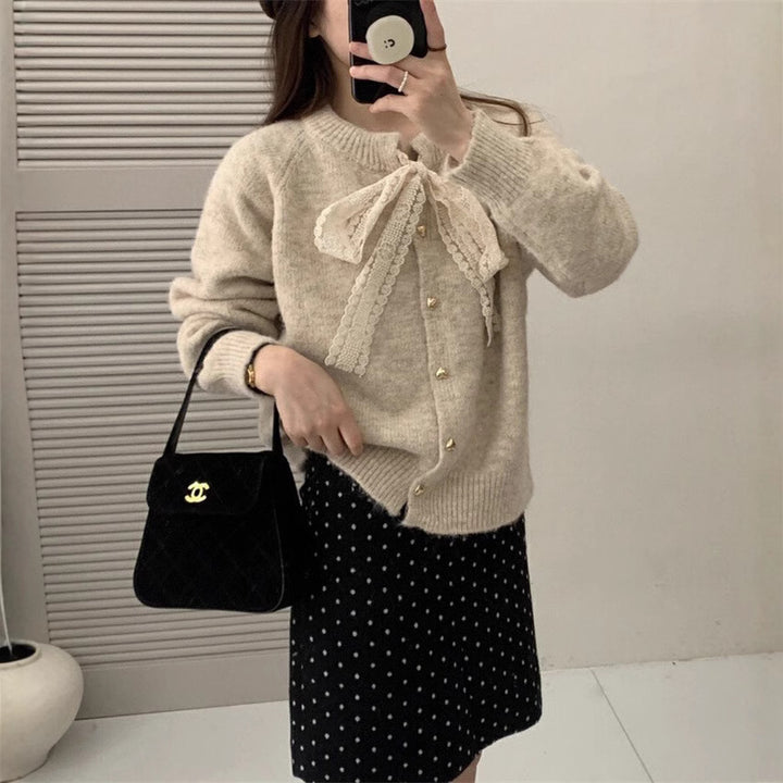 Women's knit jacket with playful lace ribbon and golden heart-shaped buttons Lune London