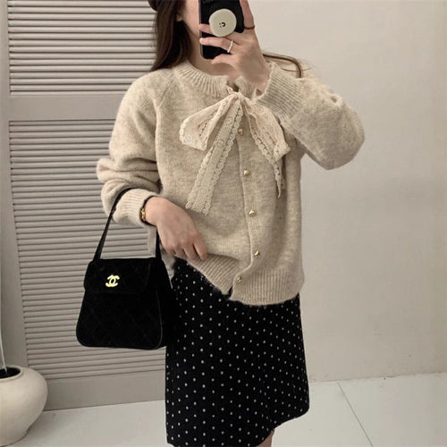 Women's knit jacket with playful lace ribbon and golden heart-shaped buttons Lune London