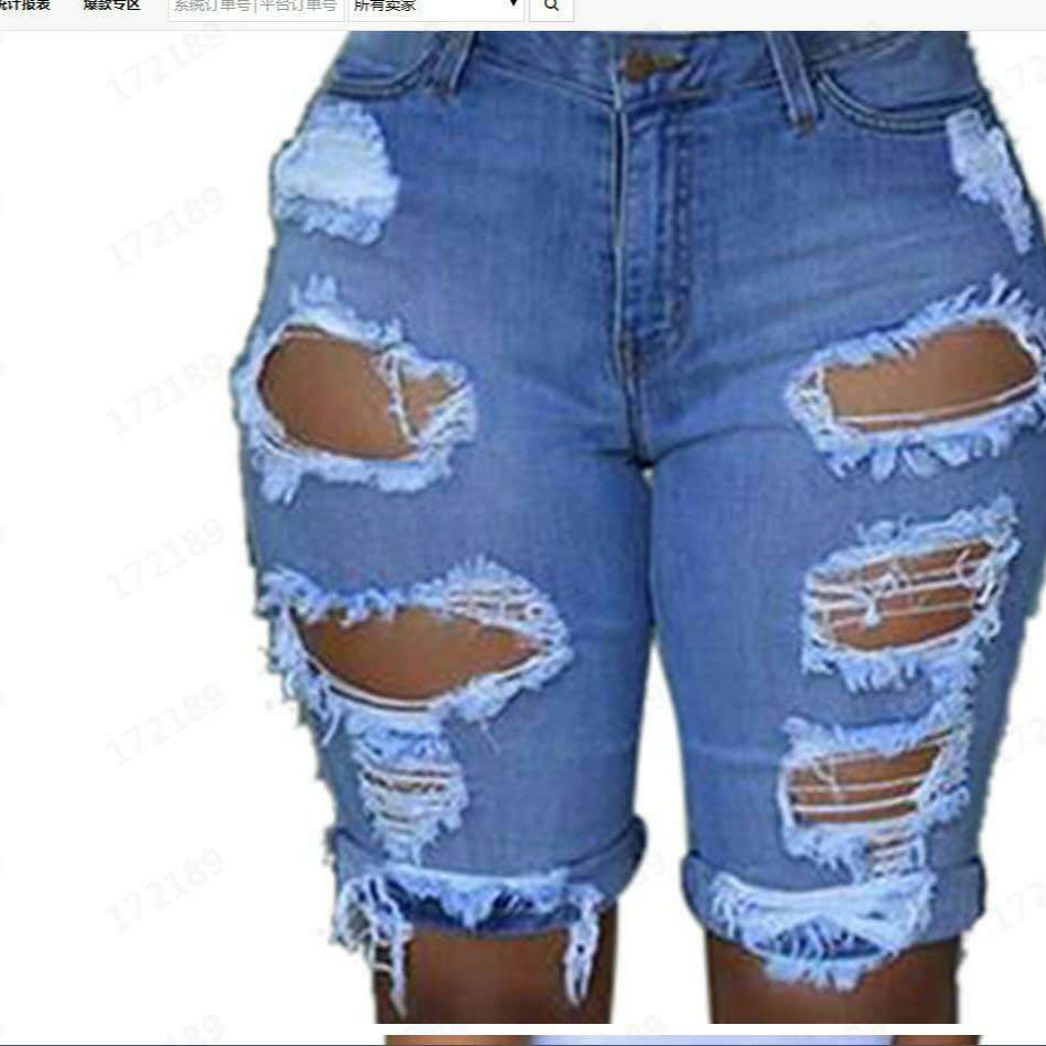 Women's destroyed denim trousers with a casual cut and trendy tear details Lune London