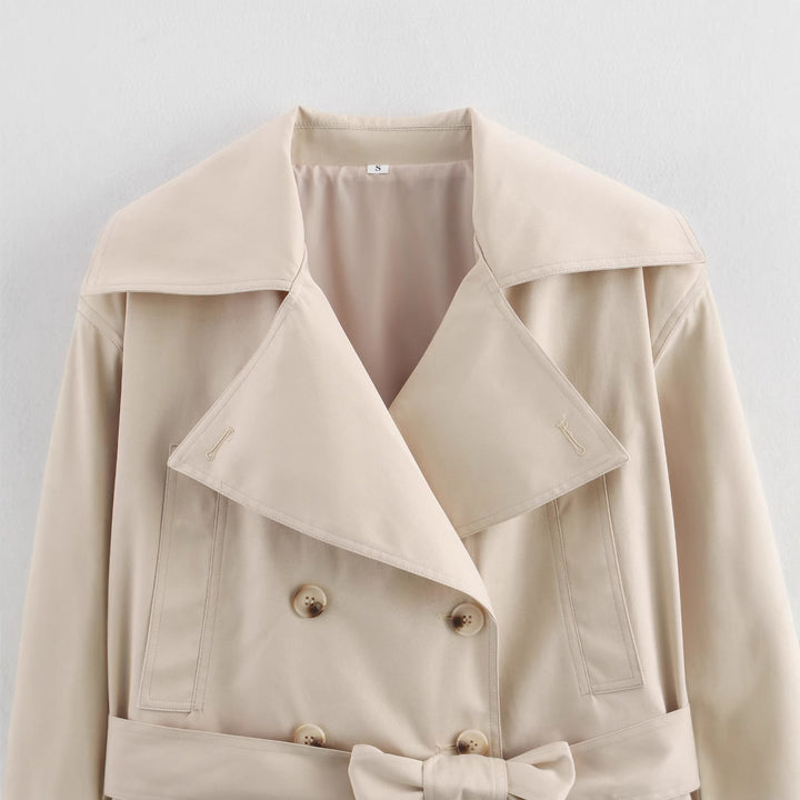 Elegant cropped trench coat for women with stylish button details and a chic belt detail