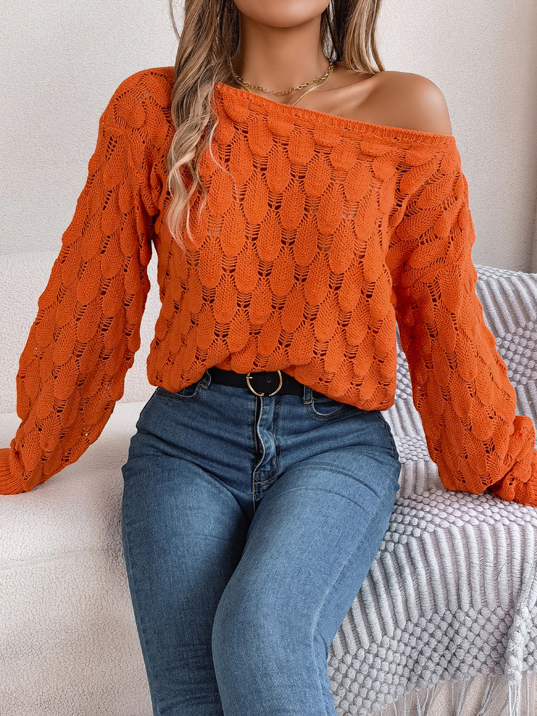 Oversized knitted sweater for women with chic knot pattern